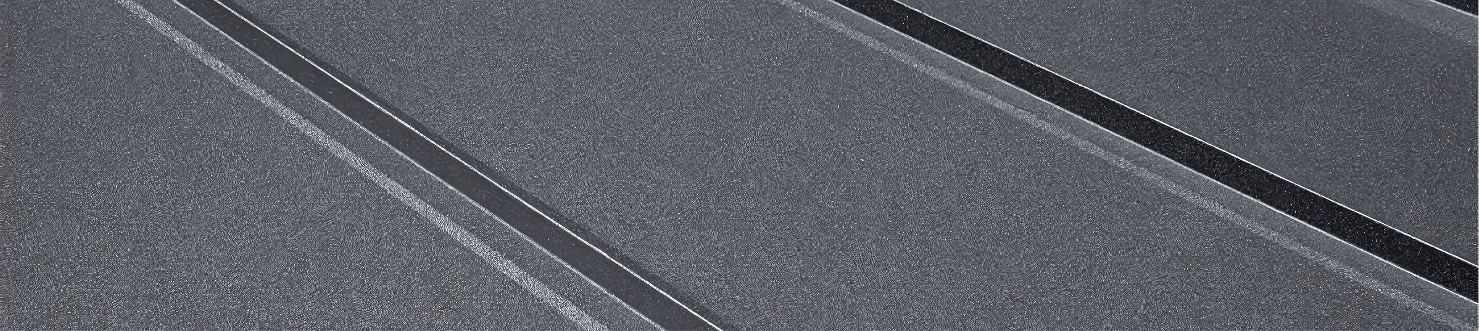 Close-up of a dark metal roof.