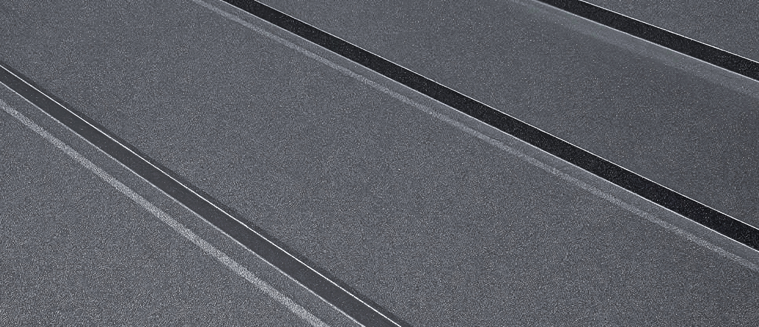 Close-up of a dark metal roof.