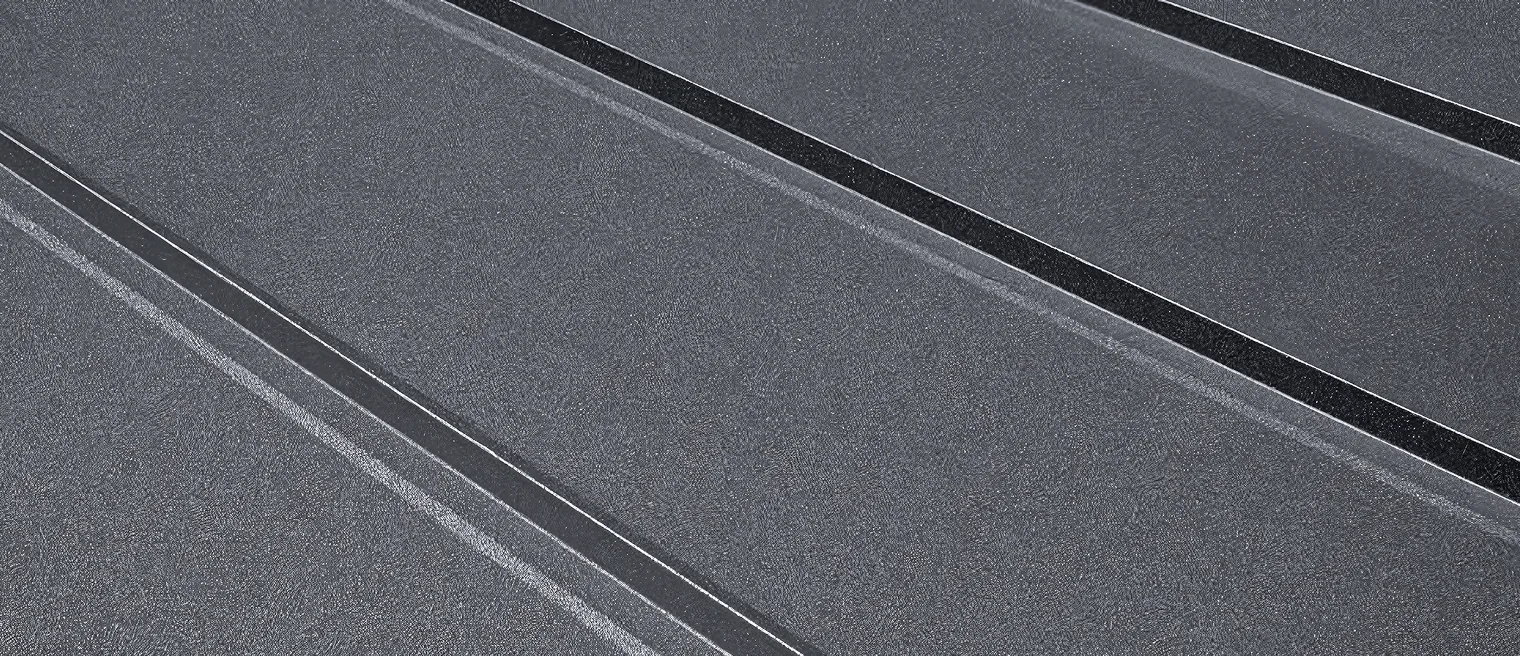 Close-up of a dark metal roof.