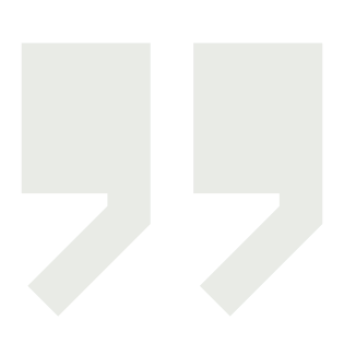 Green stylized closing quotation marks symbol.