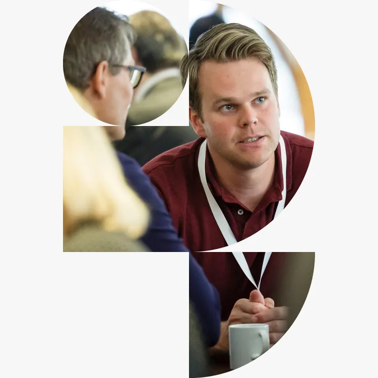 Young professional in discussion at a Generation IPG session