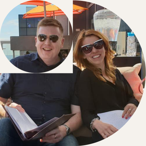 Two IPG members relaxing on a rooftop terrace during a conference