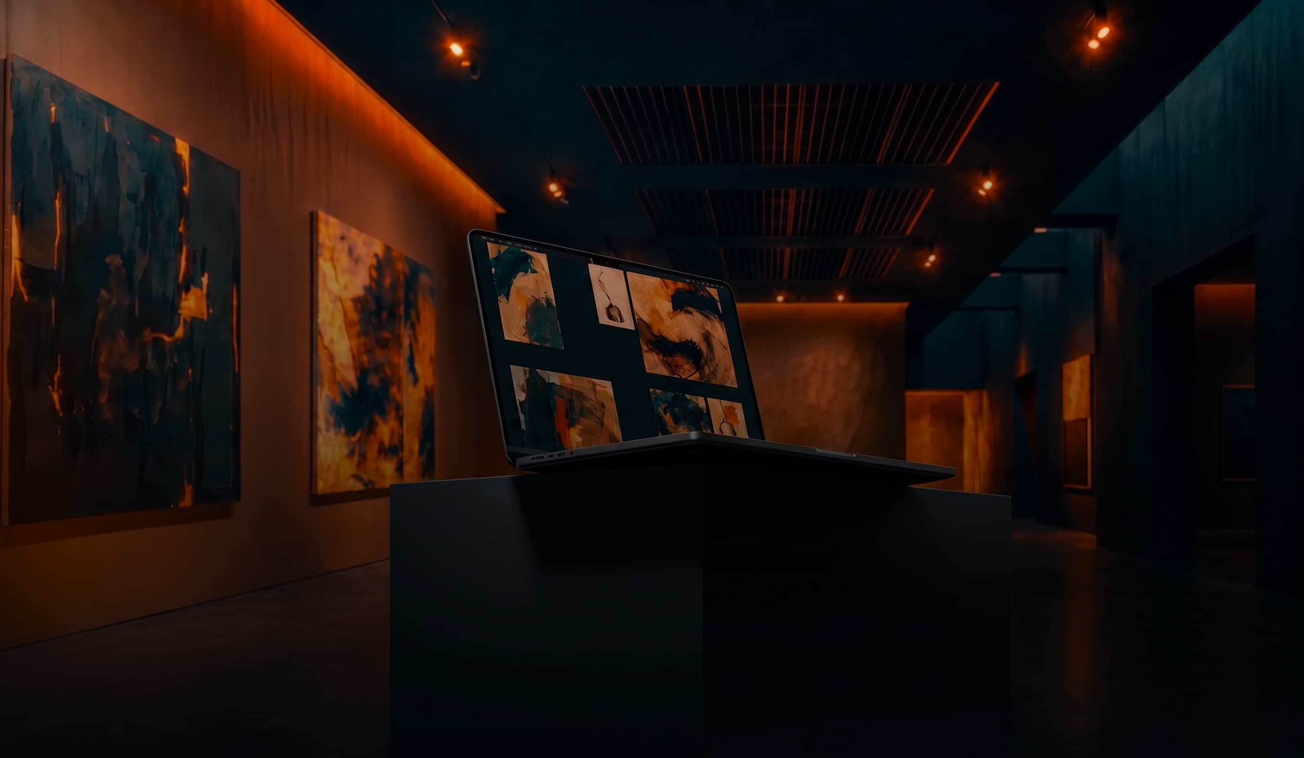 A laptop on a plinth in a warmly lit gallery, its screen showing a grid of abstract artworks