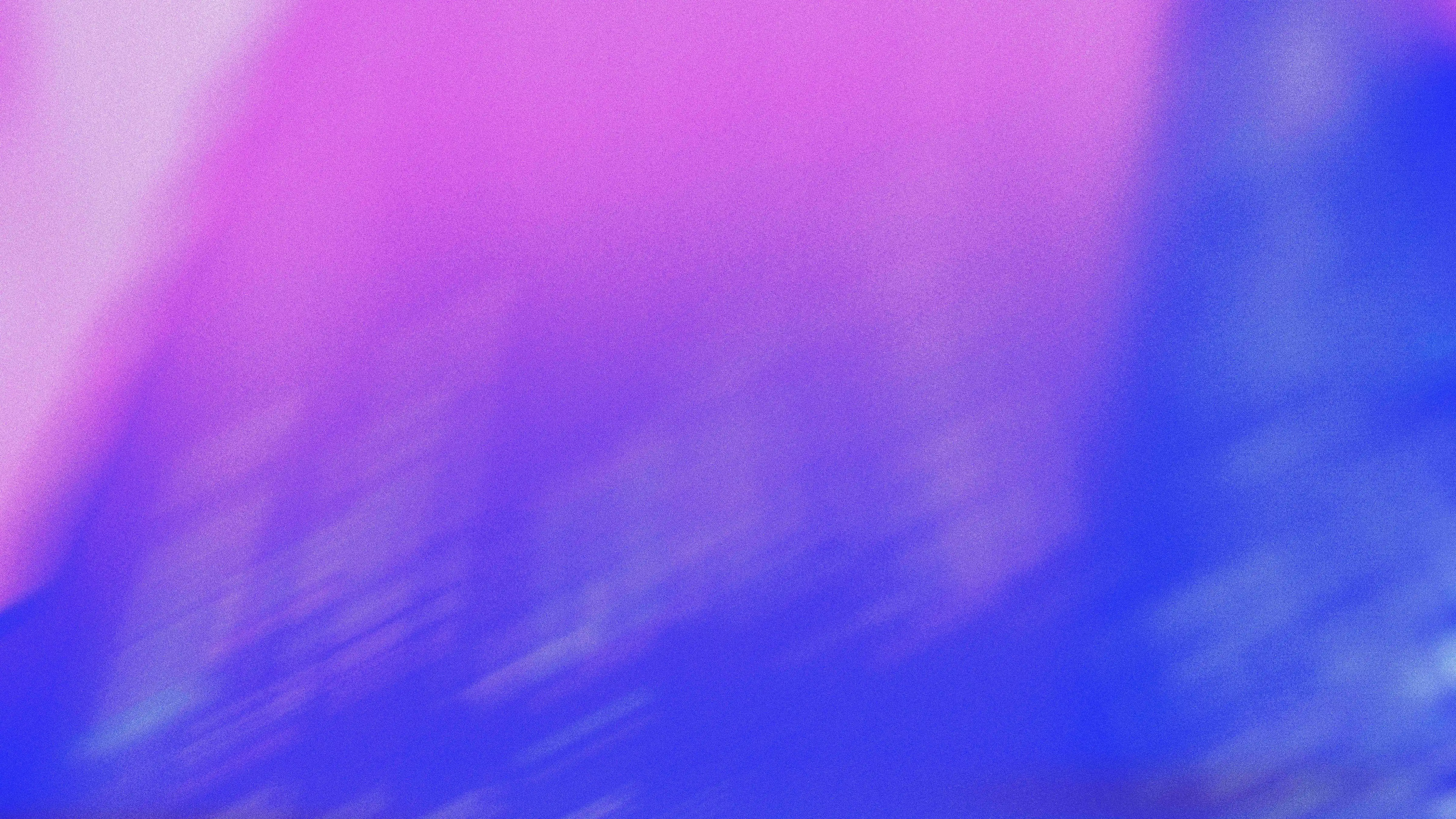 Abstract gradient background with blended purple, pink, and blue colors creating a soft, textured visual effect.