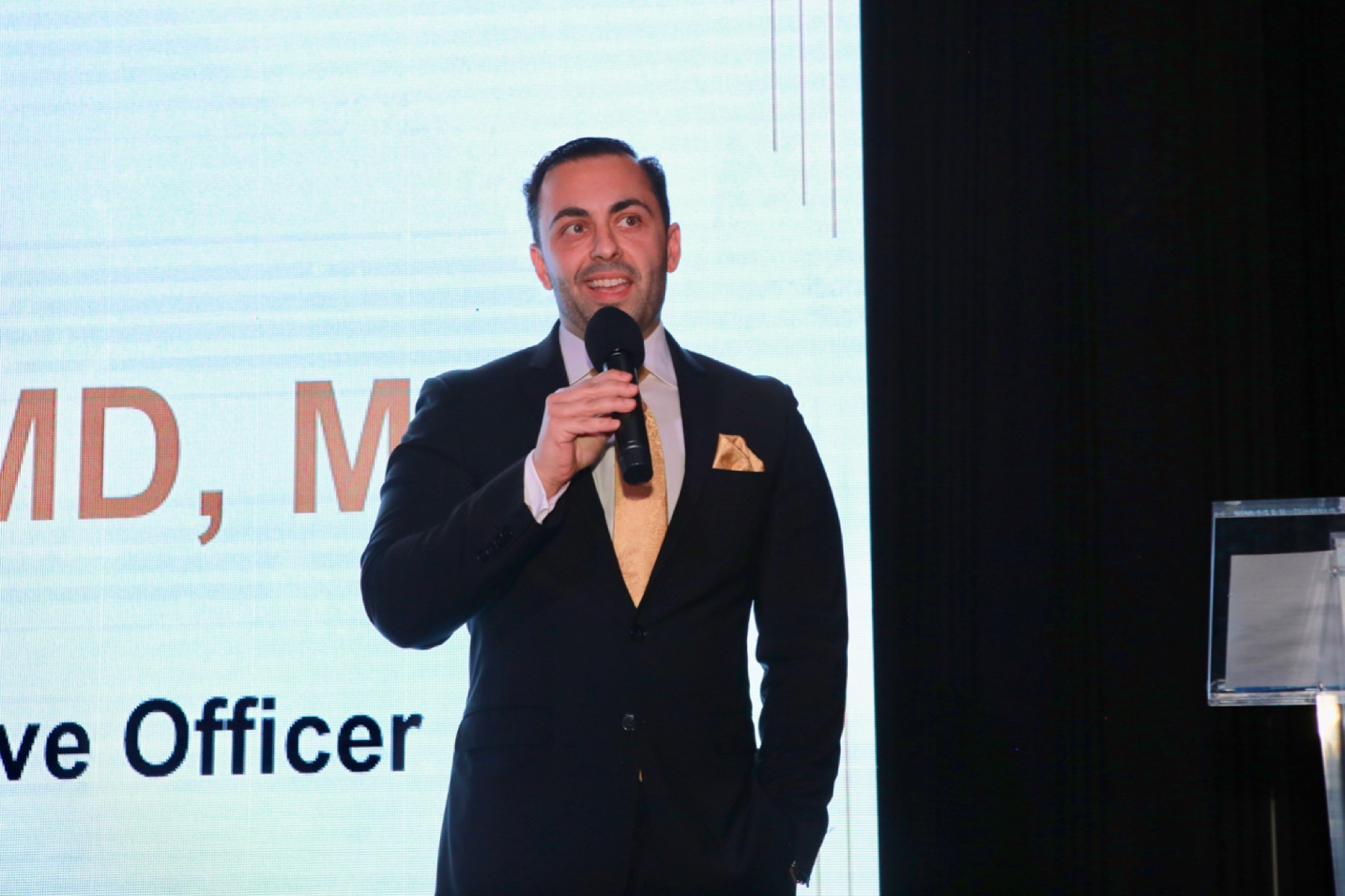 Dr. Tamir Aldad delivering a keynote at the Mindful Care Gala