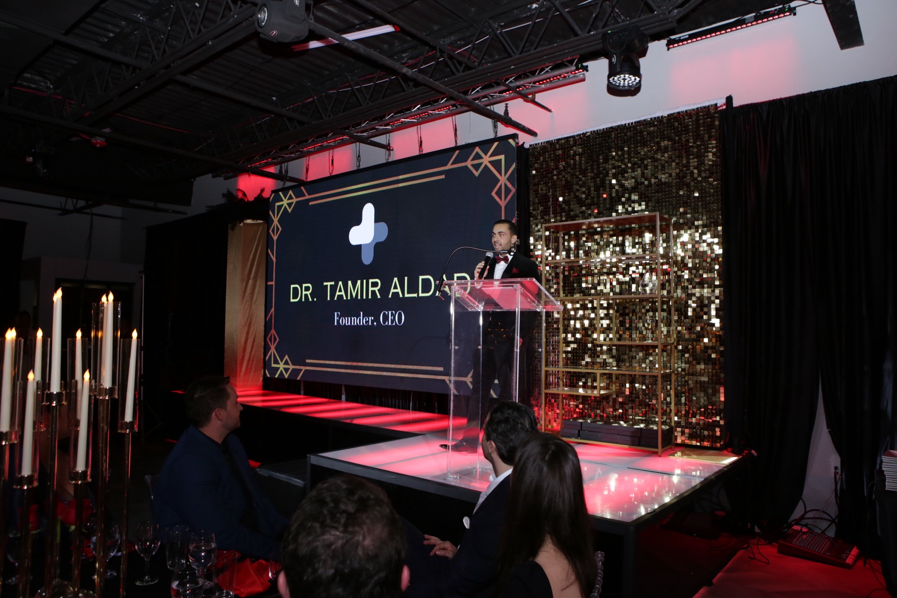 Dr. Tamir Aldad speaking at the Mindful Care Gala podium