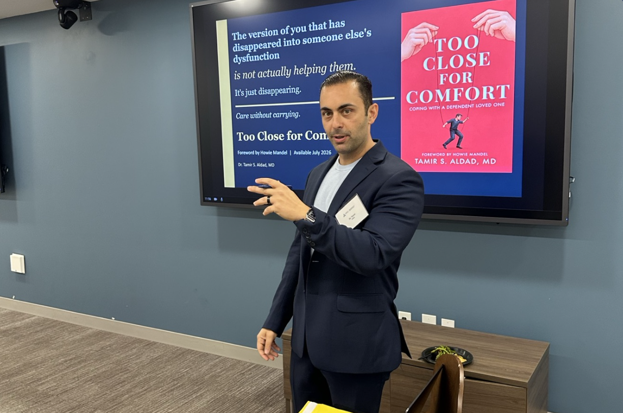 Dr. Tamir Aldad presenting Too Close for Comfort at a corporate book talk