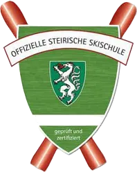 Green shield with a white lion and text, crossed skis behind: official Styrian ski school certified.