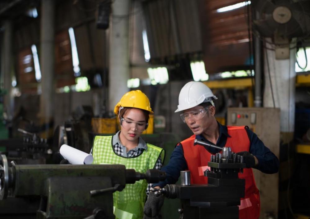 Two manufacturing employees working.