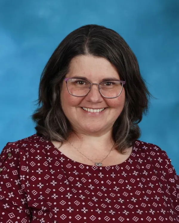 Monica Dell smiling in professional school staff portrait photo