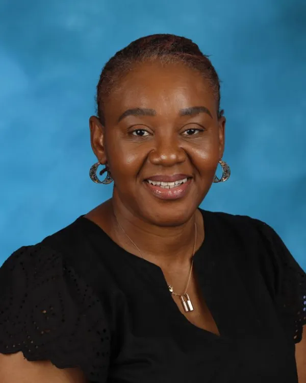 Ifeoma Oladele smiling in a professional staff headshot photo