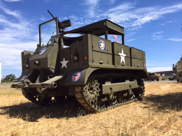Restored military vehicles on display at the American Armory Museum car show