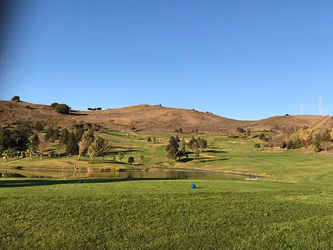 Hilly fairway with Bay views at Blue Rock Springs Golf Course East