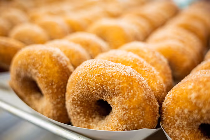 Freshly fried donuts honoring the Salvation Army's National Donut Day tradition