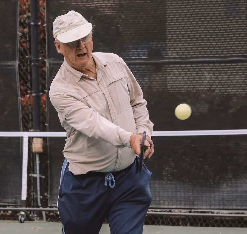 Senior using an exercise ball during a fitness workout at Paradise Valley Estates