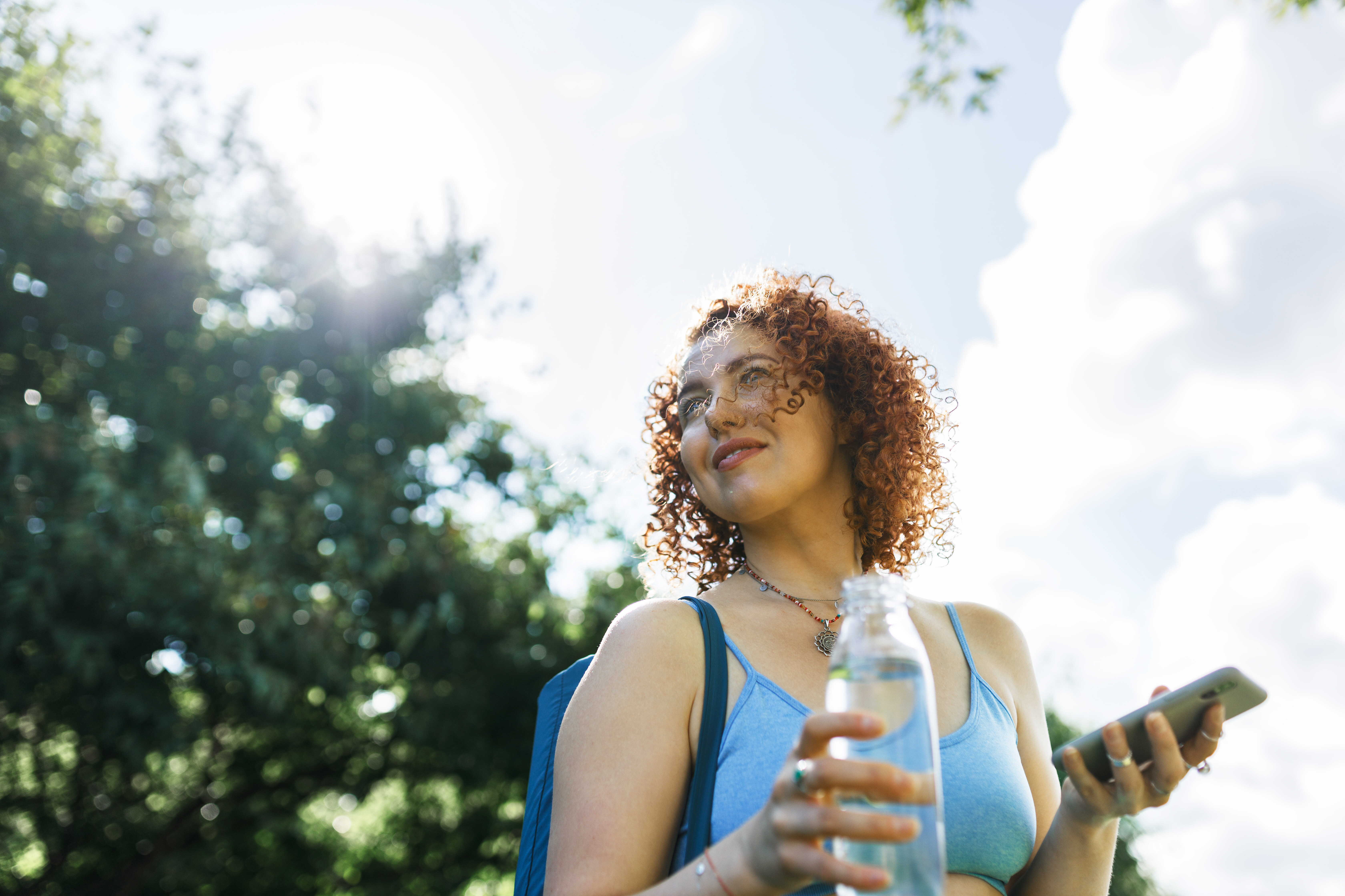 Girl walking with drink stock image