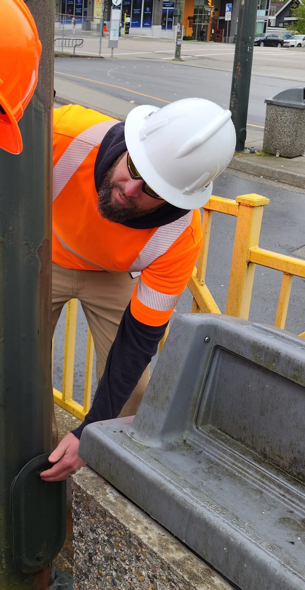Streetlight pole review for defects, access, and safety.