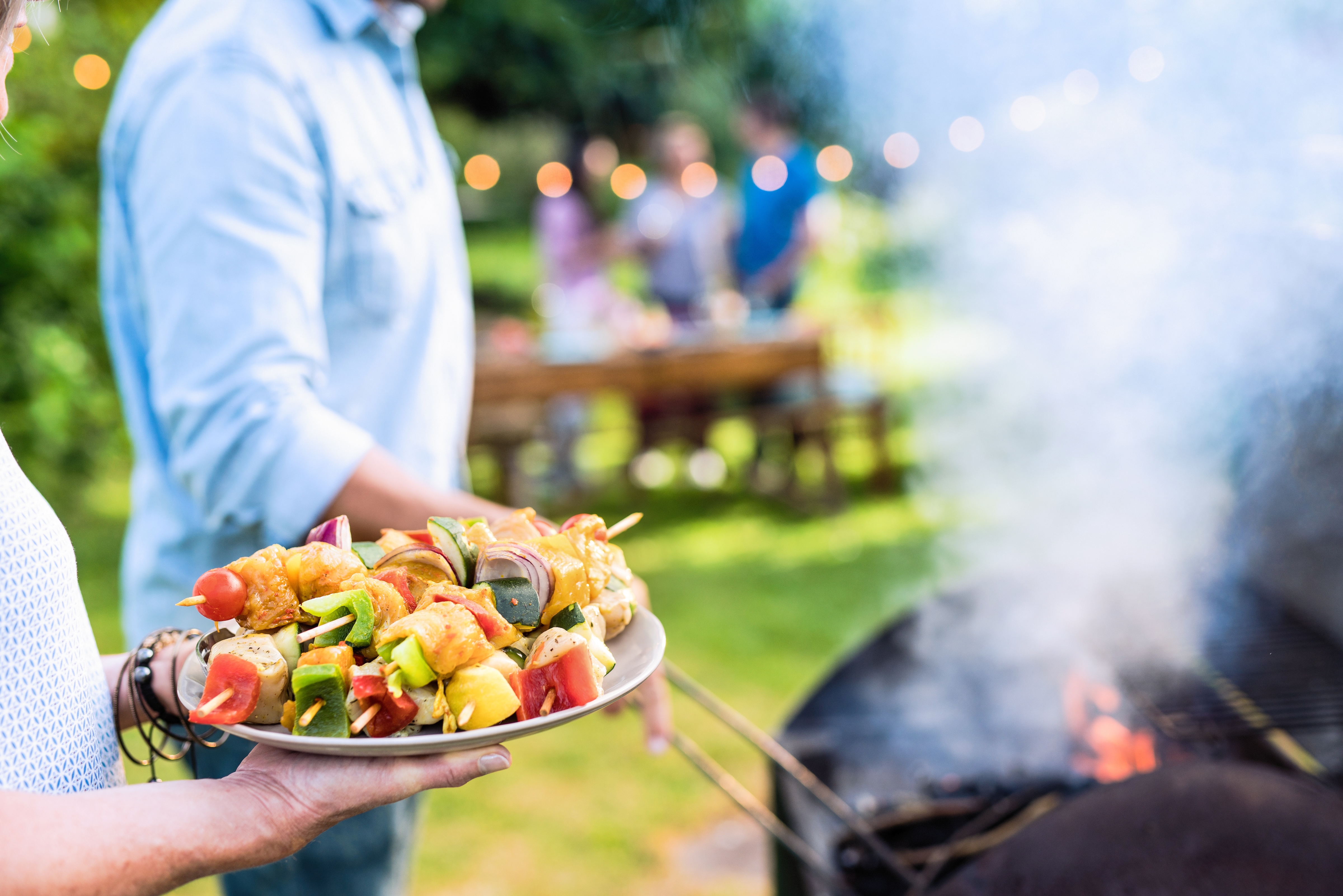 Friends BBQing outside stock image