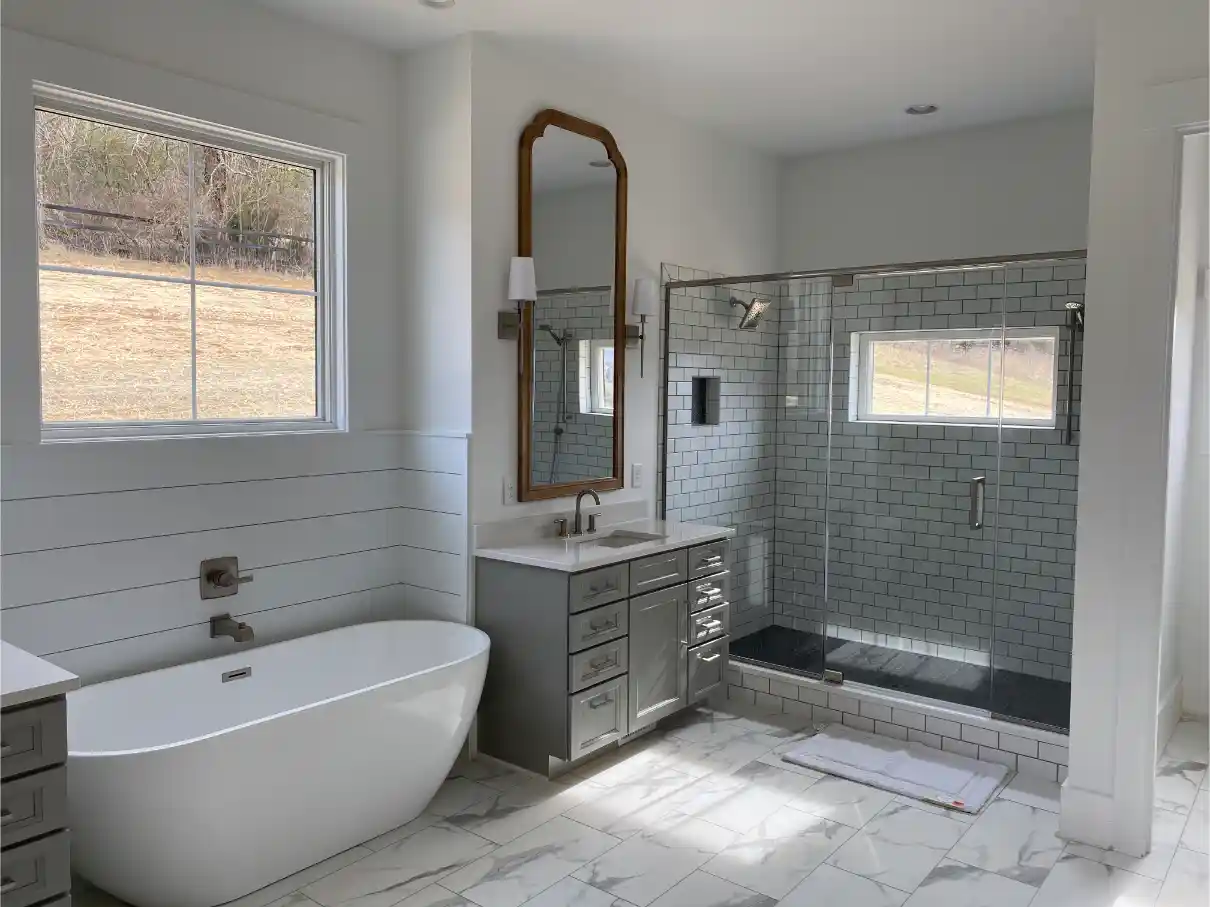 Bright master bathroom featuring a freestanding soaking tub, shiplap walls, gray vanity with white countertop, and a walk-in shower with subway tile