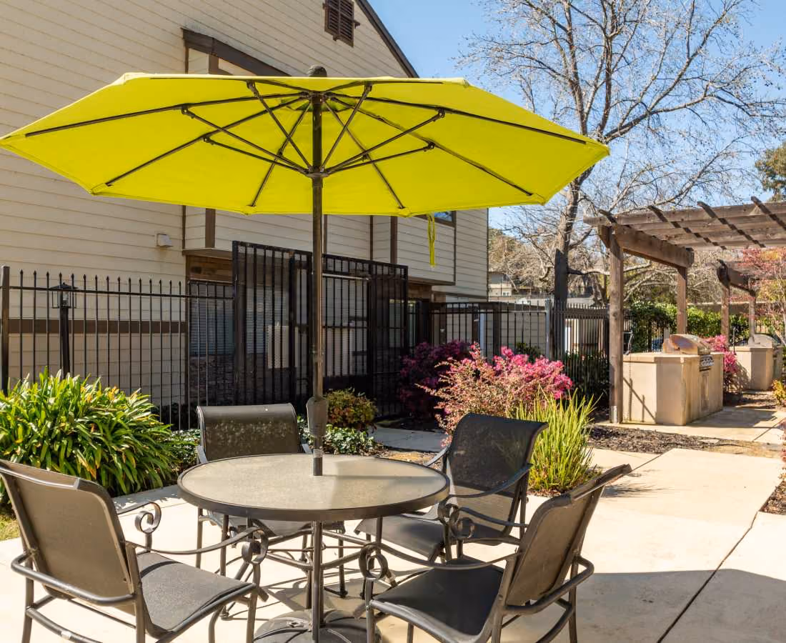Table with umbrella and chairs