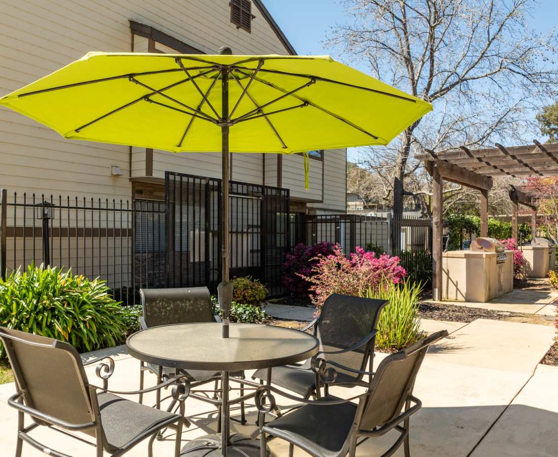 Table with umbrella and chairs