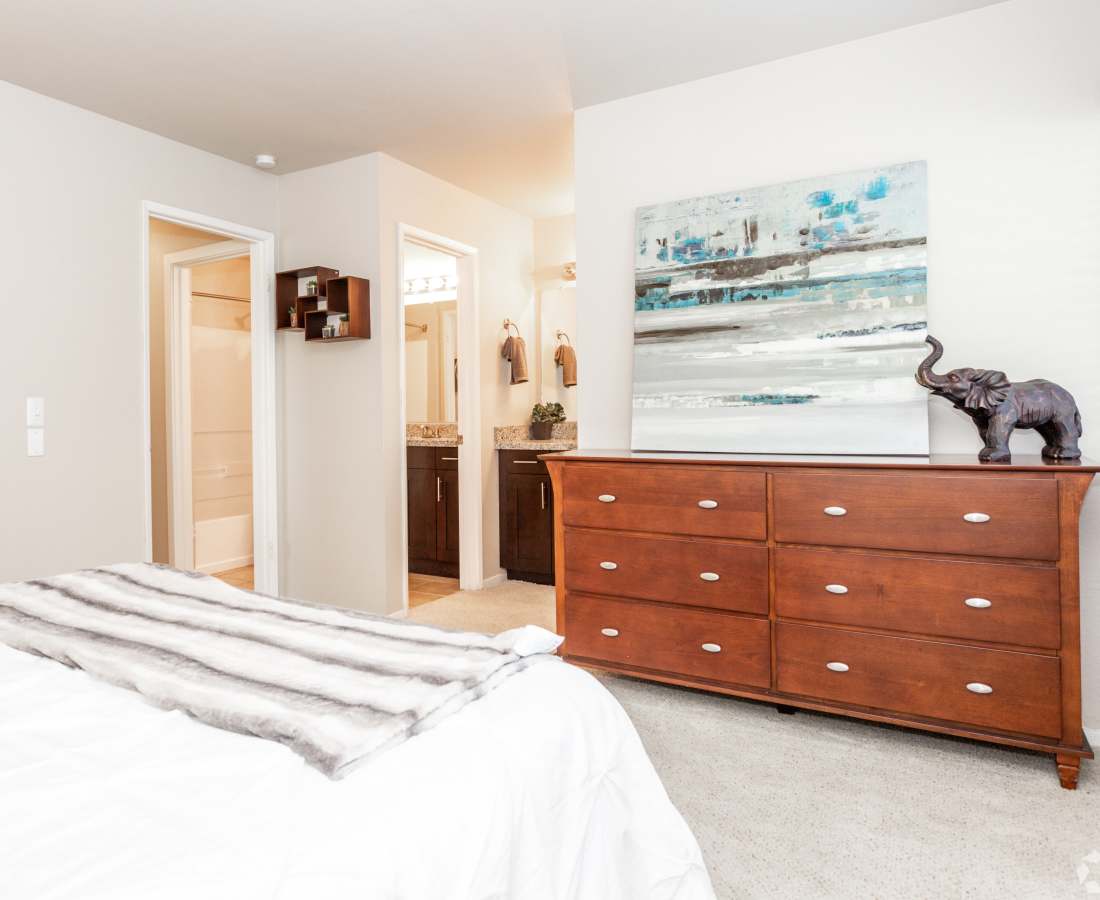 Bedroom with bed and dresser