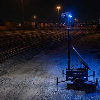 A unit in a rail yard at night.