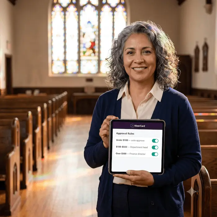 Woman smiling in church holding tablet showing approval rules for expense amounts and roles.