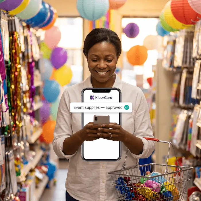 Smiling woman holding phone and shopping basket in party store with KleerCard approval message.