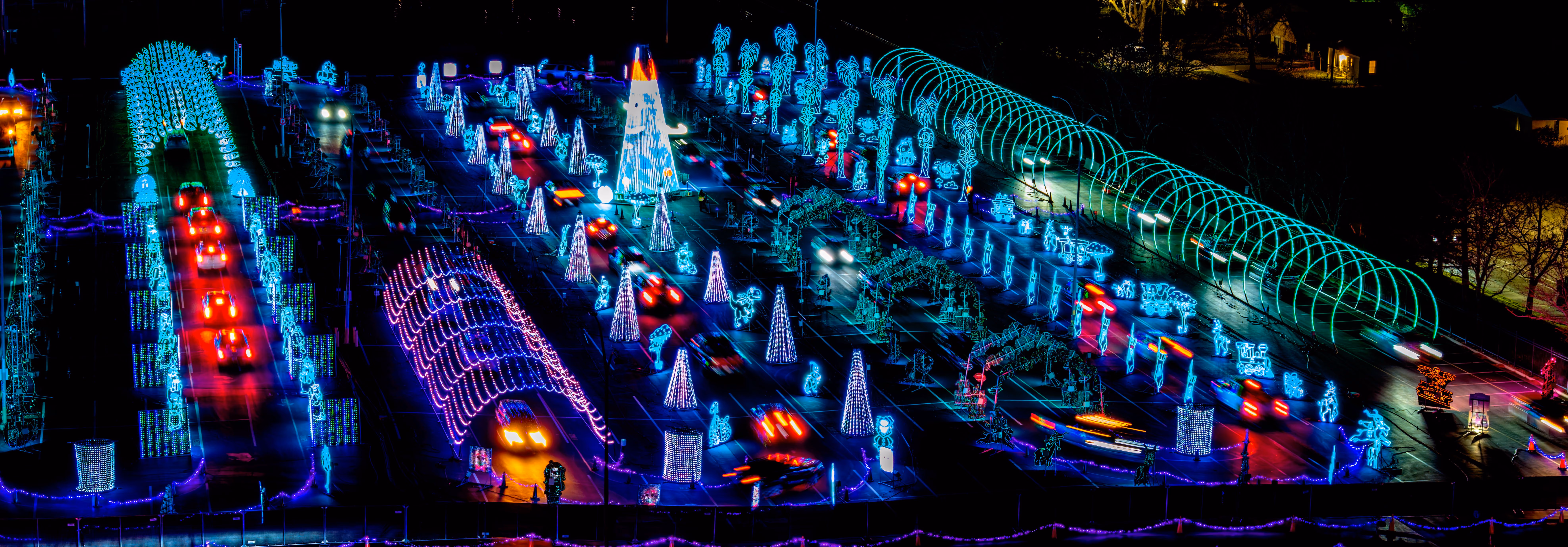 Aerial view of cars driving through the World of Illumination light show