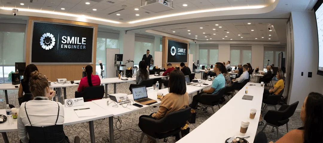 Smile Engineer training session with presenter and attendees in modern classroom
