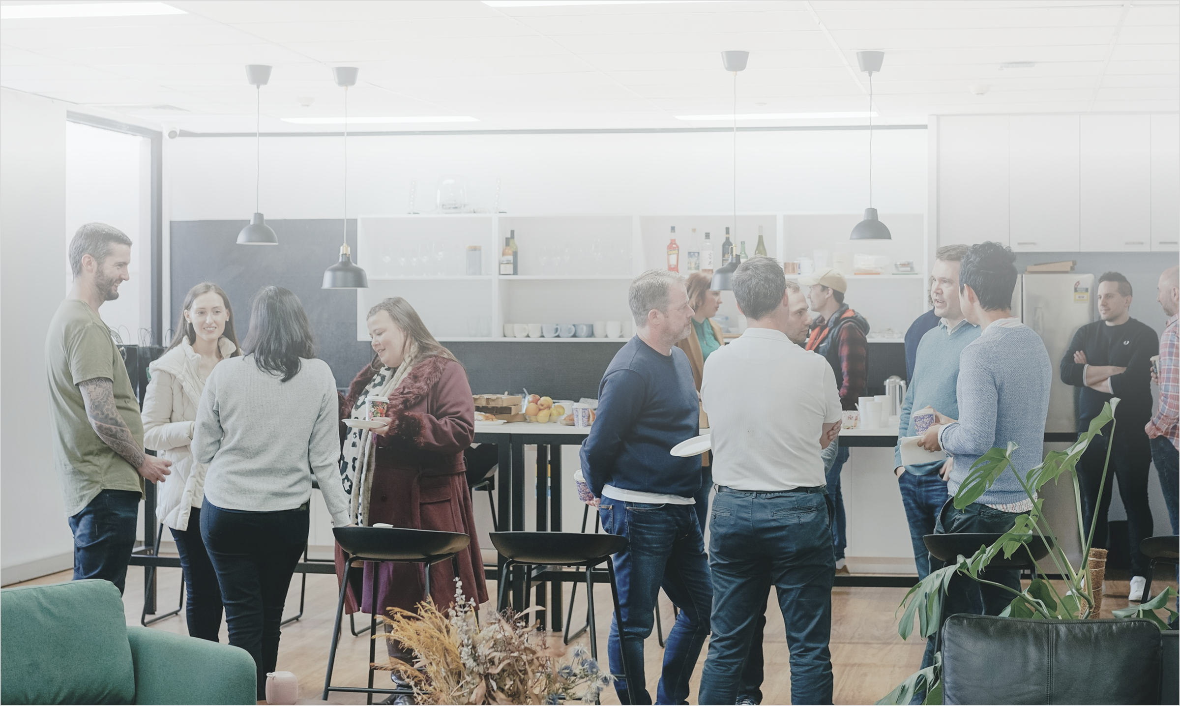 Friendly group of co-workers networking at an event.