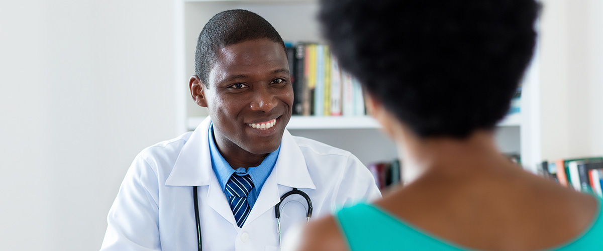 Surgeon talking with reluctant patient