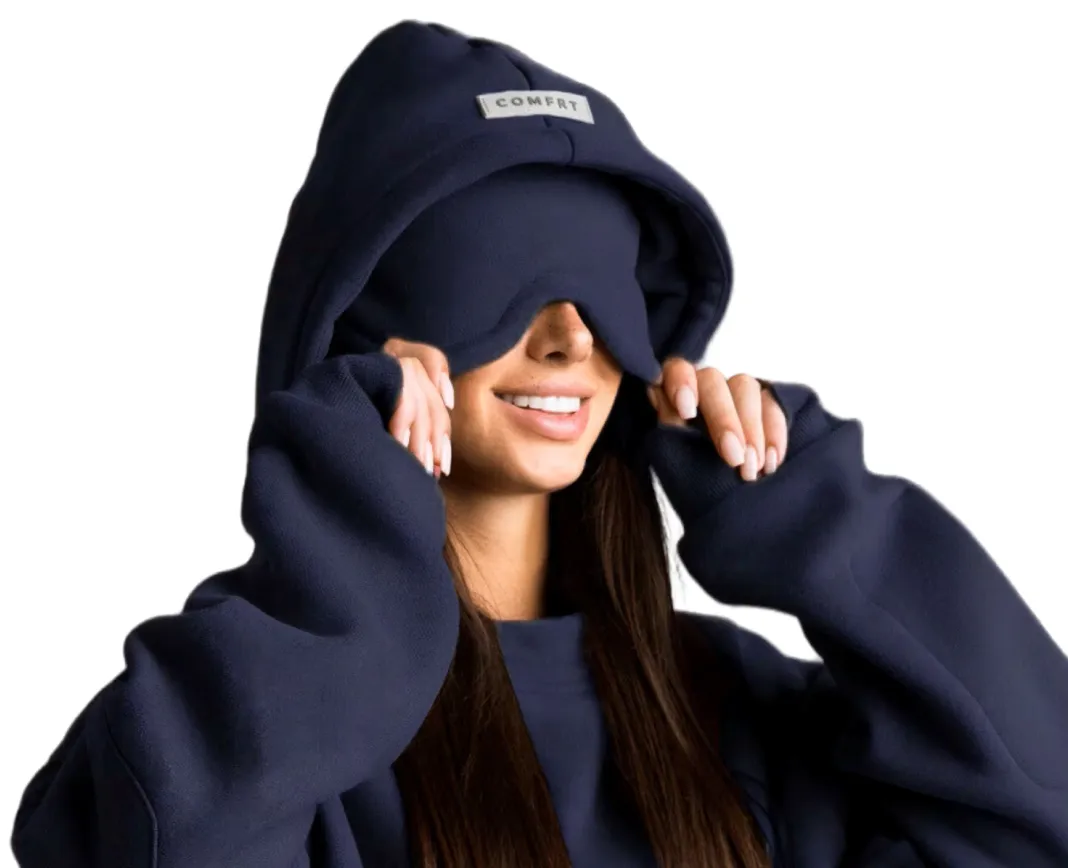 Woman wearing a navy Airplane Mode Hoodie with the built-in eye mask pulled over her eyes
