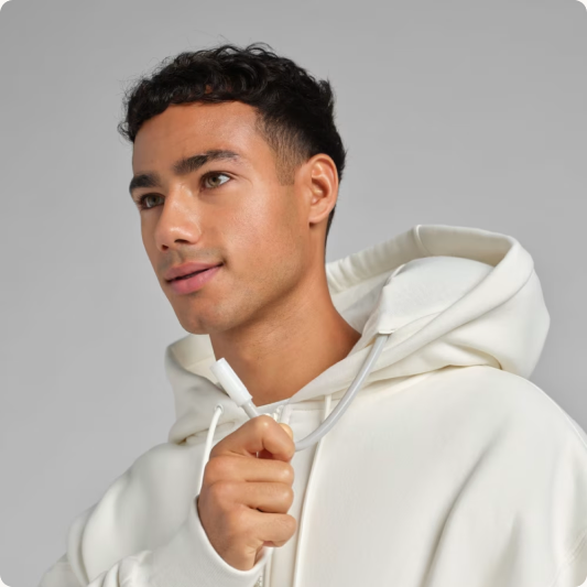 Inflating the neck cushion in the Shell Inflate Zip Hoodie