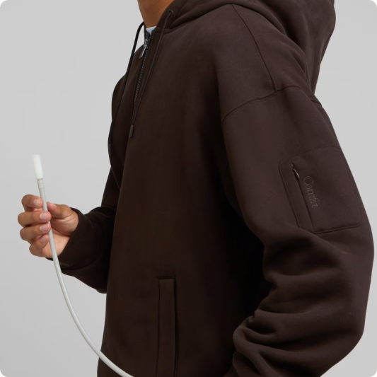 Inflating the removable lumbar cushion in the Espresso Inflate Zip Hoodie