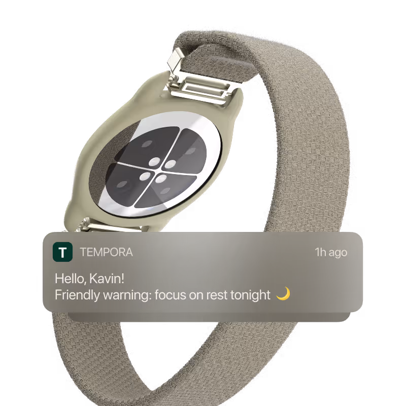 Fitness smartwatch with fabric band showing a rest reminder message from app Tempora.