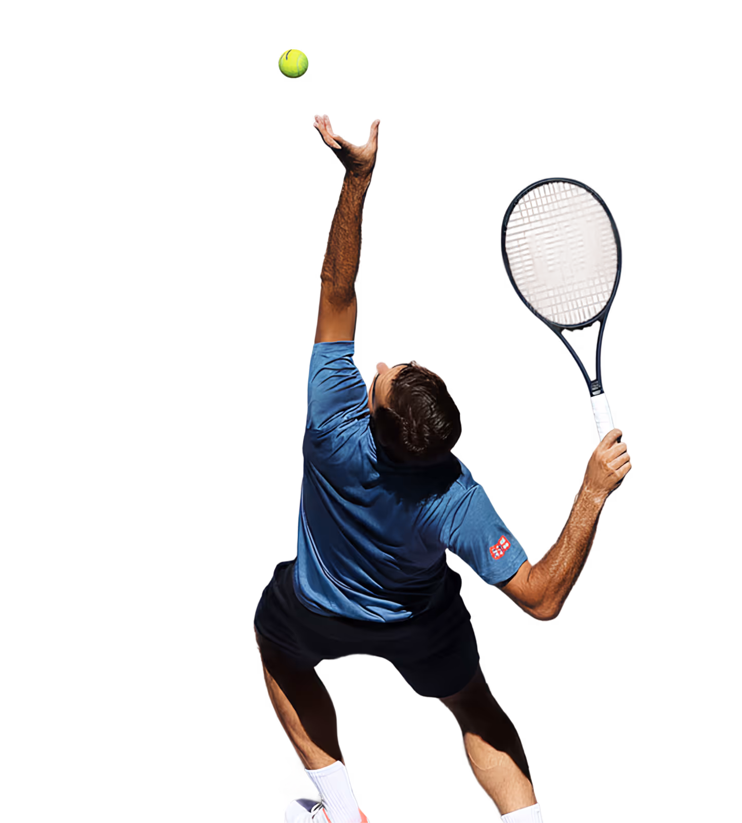 Male tennis player in blue shirt poised to serve, tossing a ball in the air with racket ready.