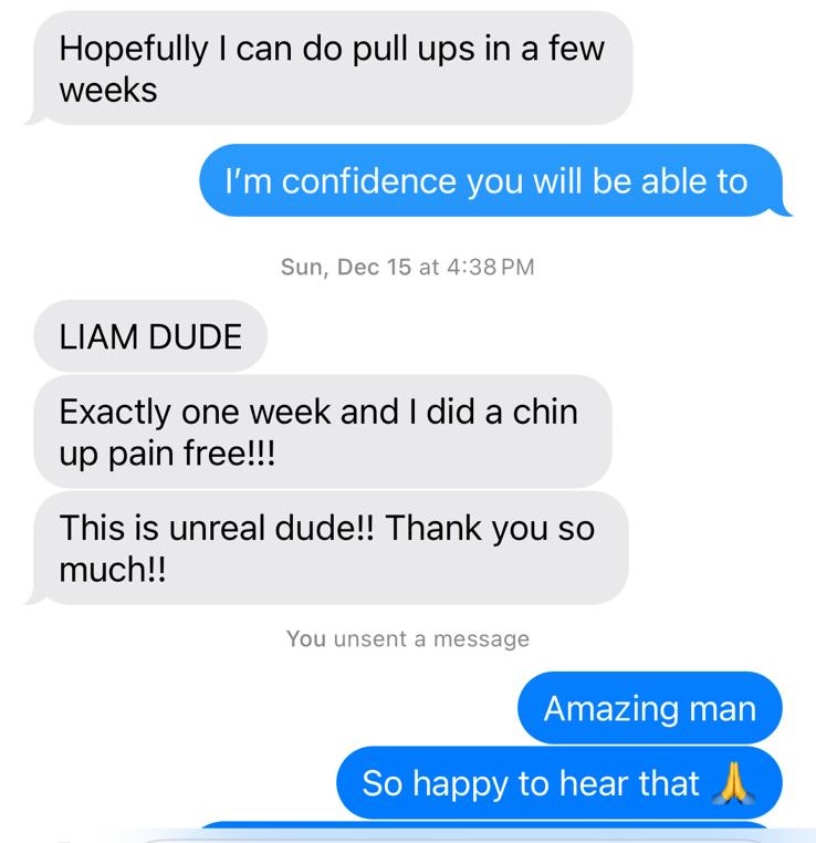 A customer celebrates completing a chin-up