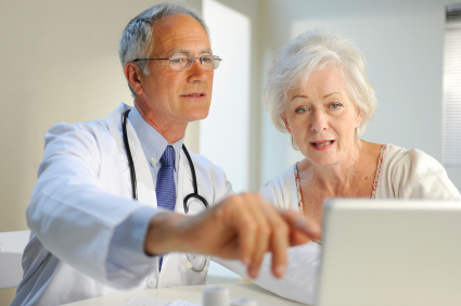 Doctor and patient during a CIMT ultrasound consultation