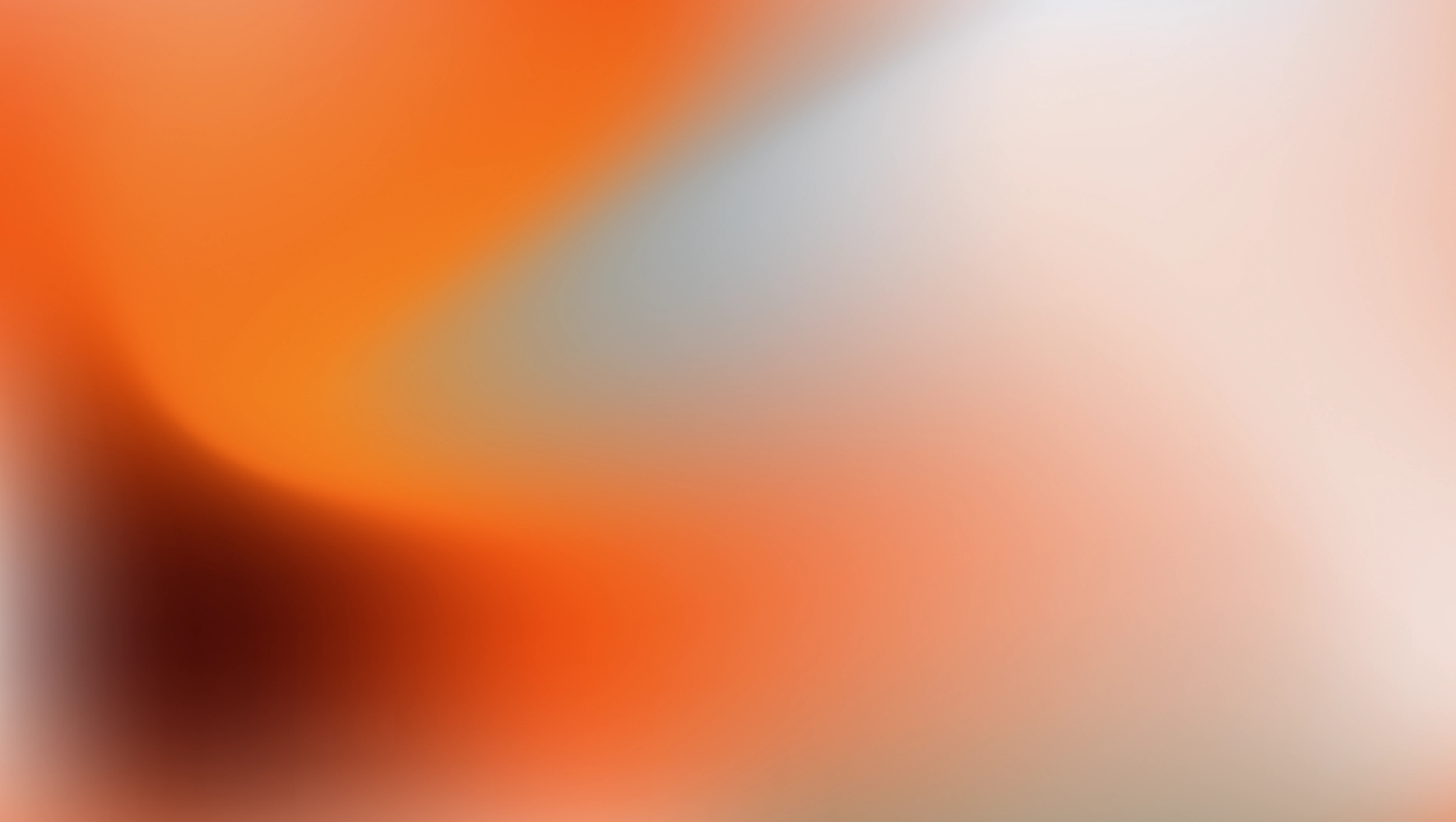 Abstract gradient background with blended orange, white, and gray colors.