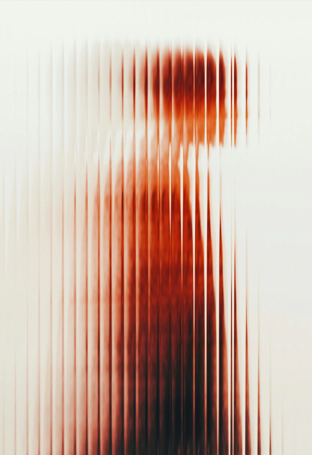 Blurred figure of a person raising an arm behind textured vertical glass or screen.
