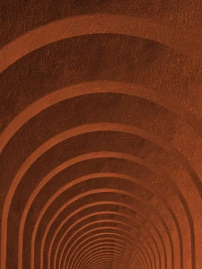 Curved, tunnel-like arches in a warm brown textured surface, creating a repeating pattern.