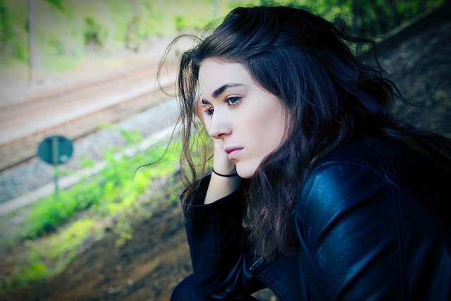 A woman overlooking a window