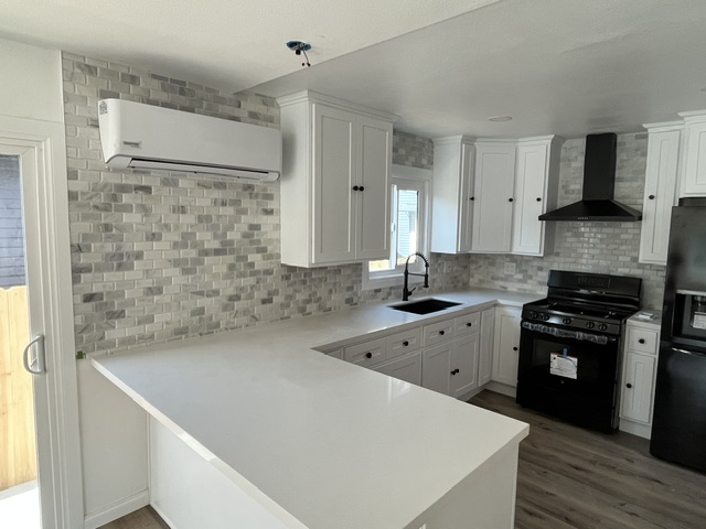 Kitchen remodel with farmhouse sink and stone mosaic backsplash, Orange County