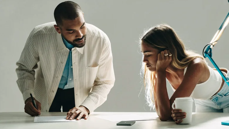 Two people working together at a table