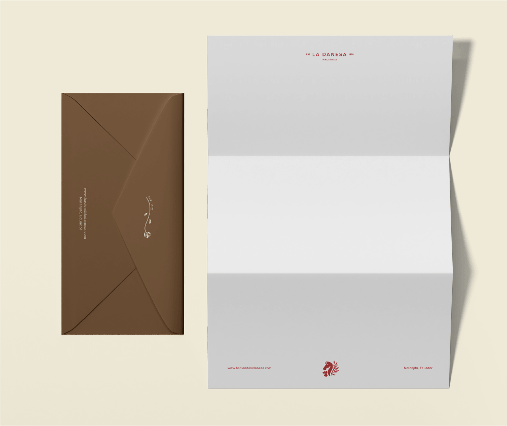 Stationery design for La Danesa by Lunalunares, showing a brown envelope and minimalist letterhead with refined logo placement, brand marks, and warm neutral tones.
