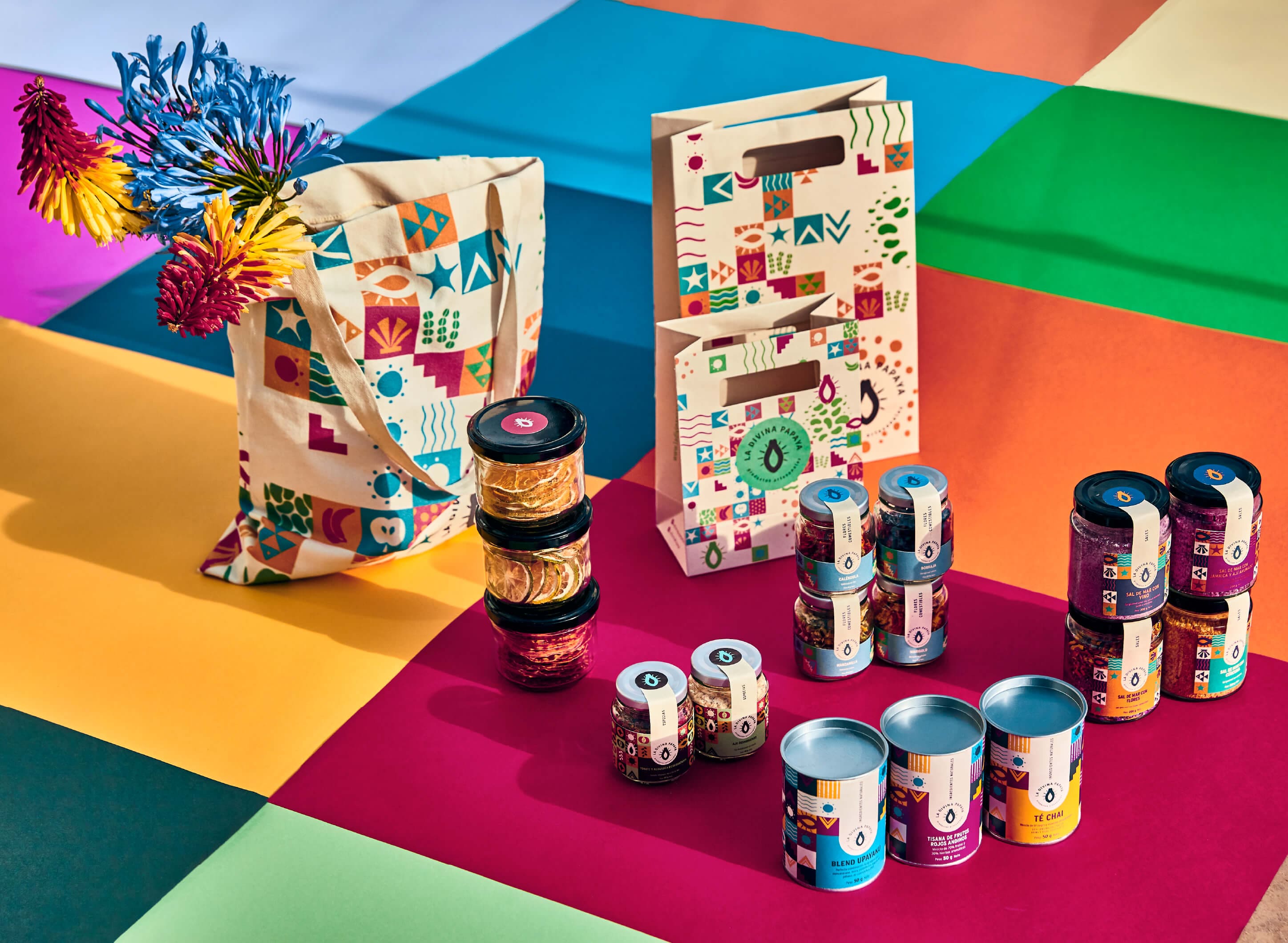 Artisan packaging collection for La Divina Papaya by Lunalunares, showcasing a complete visual identity system across bags, jars, tins, labels, and printed brand applications.