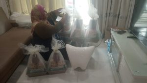 Volunteers loading community gift packages