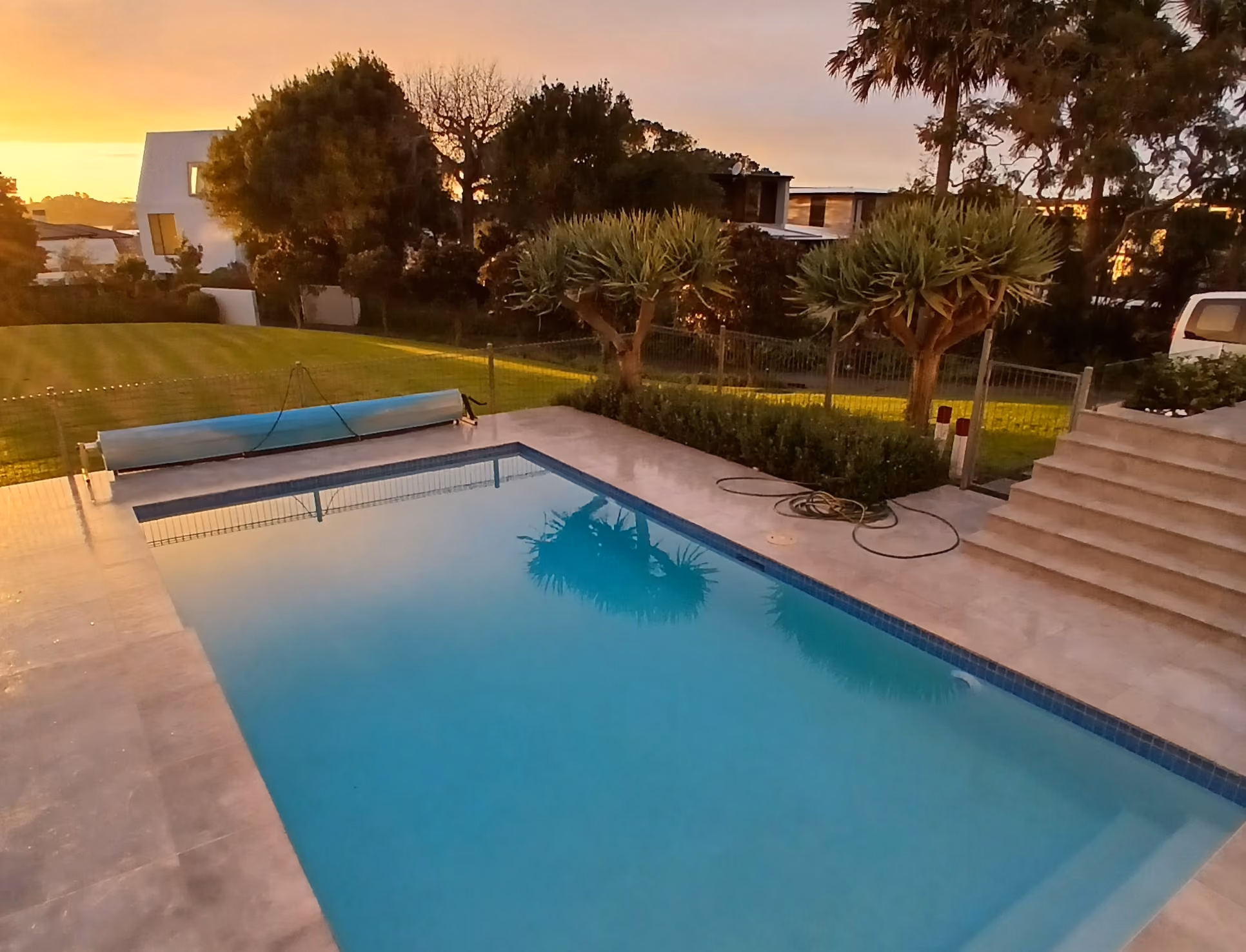 A complete pool renovation featuring a premium NZ Pool Pebble resurfacing, new feature wall tiling, upgraded LED lighting, and modern automated pool equipment, transforming a tired pool into a stunning, low-maintenance centrepiece.